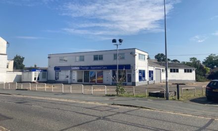 Site of former car showroom with permission for 55 apartments up for sale